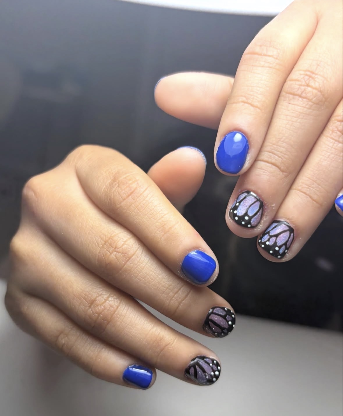 Blue butterfly nails